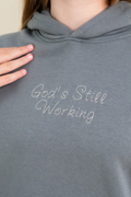 Gods Still Working Hoodie by Elevated Faith
