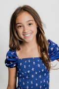 Lexi Rose Bow Navy Satin Smocked Dress by THEME